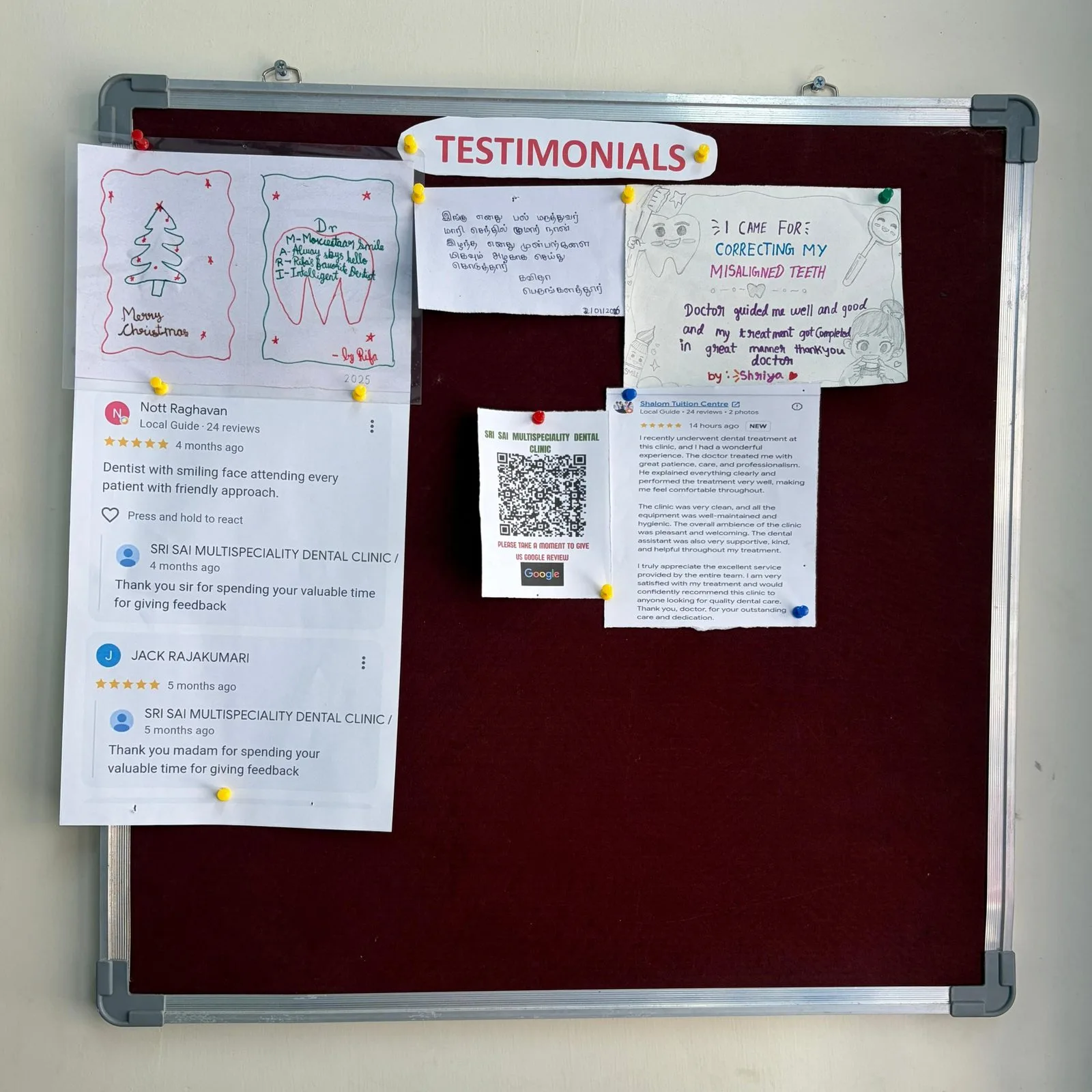 Noticeboard in the clinic headed Testimonials, pinned with handwritten thank-you notes and drawings from patients alongside printed Google reviews